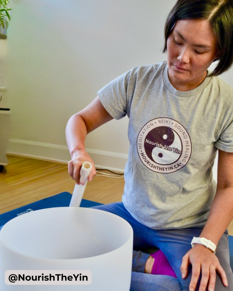 Image of Dorothy playing a crystal singing bowl.
