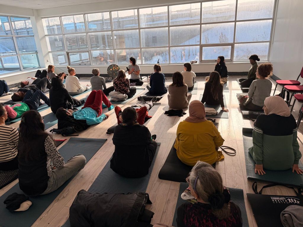 Image of Dorothy facilitating a corporate sound therapy and breathwork wellness event.